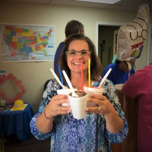 Kendyll Miller, HR Director, hands out snowcones